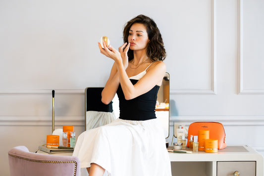 Woman applying face cream in luxury skincare routine